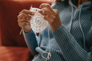 photo of woman knitting