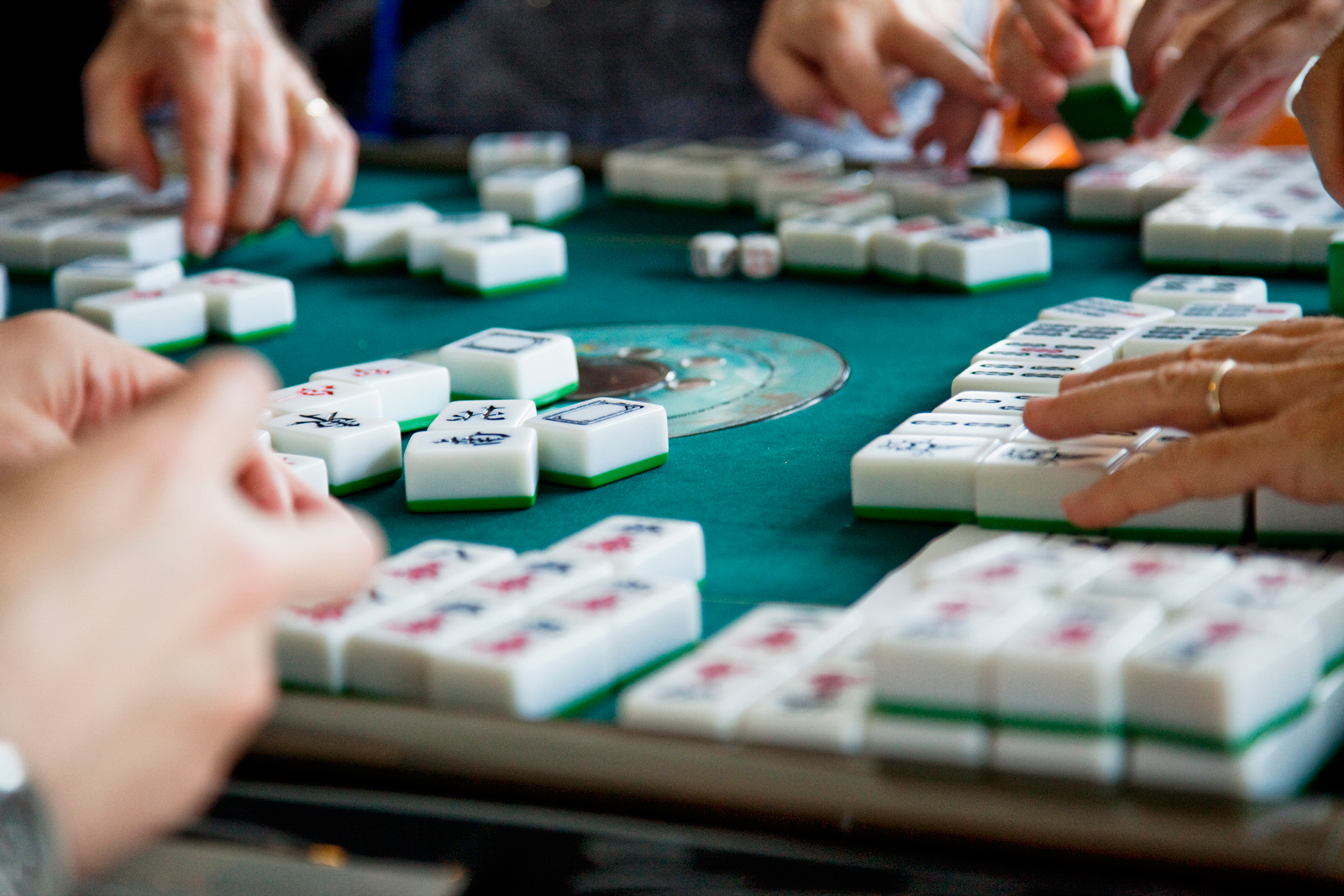 Mahjong players at game table