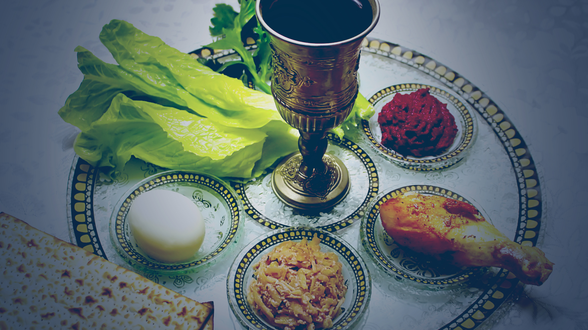 A seder plate and invitation to join Bnai Shalom for Passover on April 16, 2022 at 5:00 P.M. - Make reservations today.